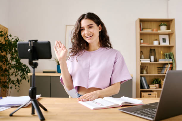 istock Blogger Waving Hand To Audience 1400105061