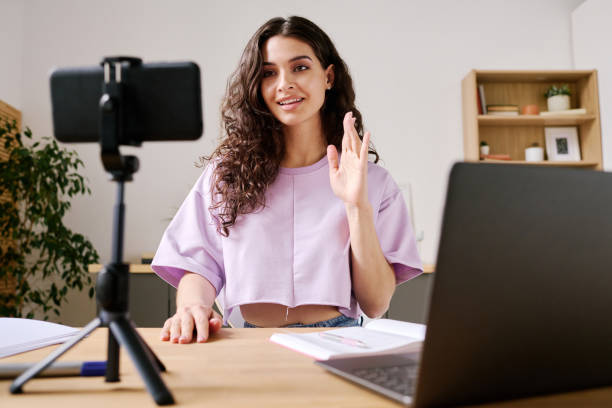 istock Woman Greeting Her Watchers 1400105081