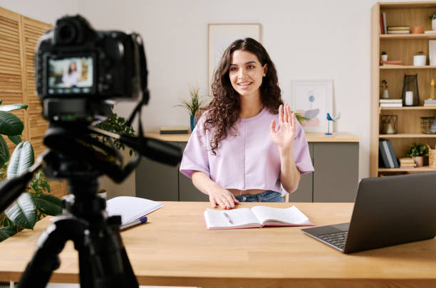 istock Blogger Waving Hand To Watchers 1400105090