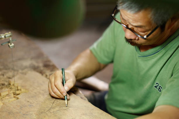 istock Engraving and creation by a senior disability woodcarver 1400105446