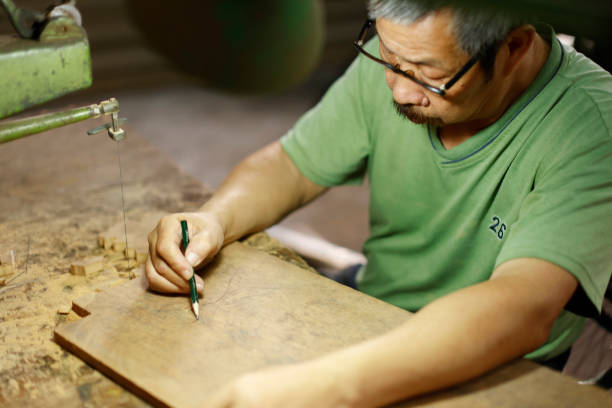 istock Engraving and creation by a senior disability woodcarver 1400106471