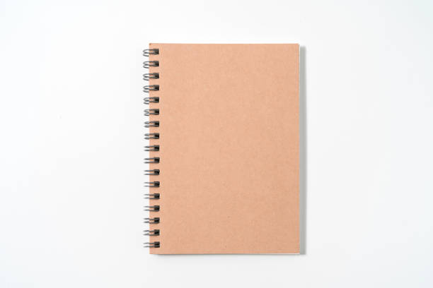 istock Brown spiral notebook isolated on white background.top view 1400107978
