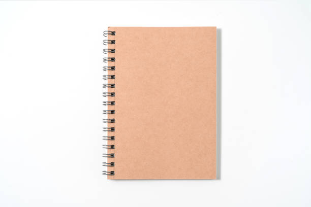 istock Brown spiral notebook isolated on white background.top view 1400108047