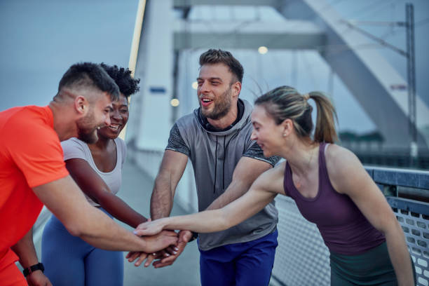 istock Athletes outdoor in hand huddle 1400108293