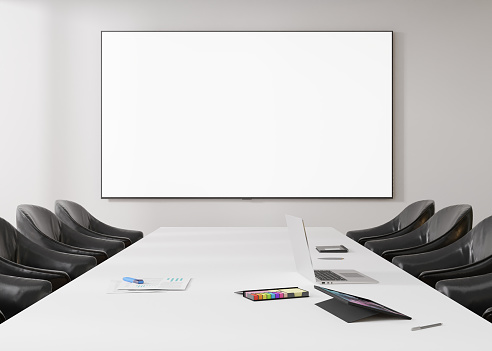 Conference room with blank, empty TV screen. Monitor mock up. Business meeting room with LCD screen for presentation, advertising. Modern, contemporary office. Copy space, template. 3d rendering