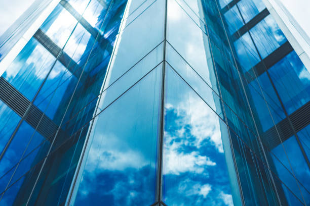 istock underside panoramic and perspective view to steel blue glass high rise building skyscrapers 1400109701