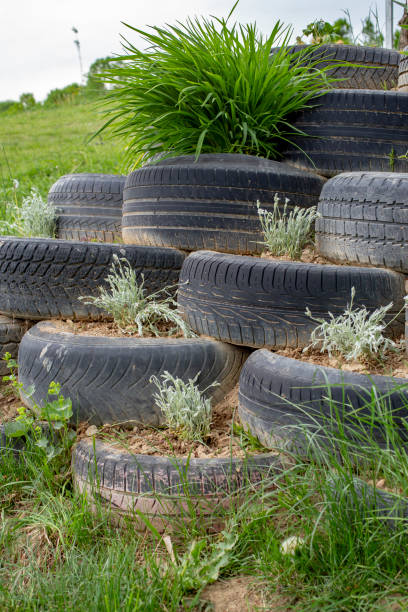 istock Tire wall filled with earth  made for hill consolidation. 1400112143