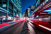 istock London red buses zooming through City skyscrapers night street 1400112152