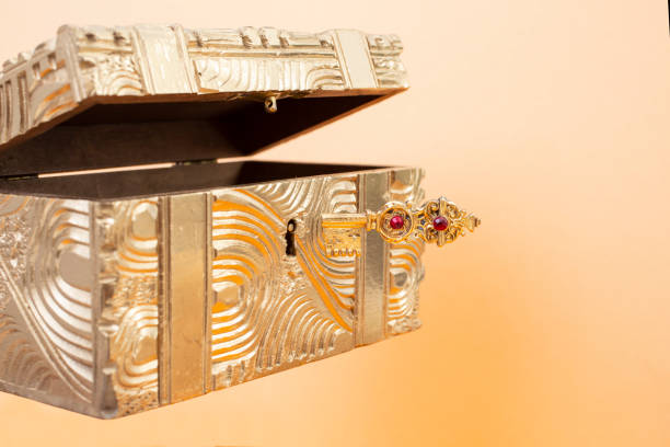 istock Levitating golden key, opening a gold box, 1400112306
