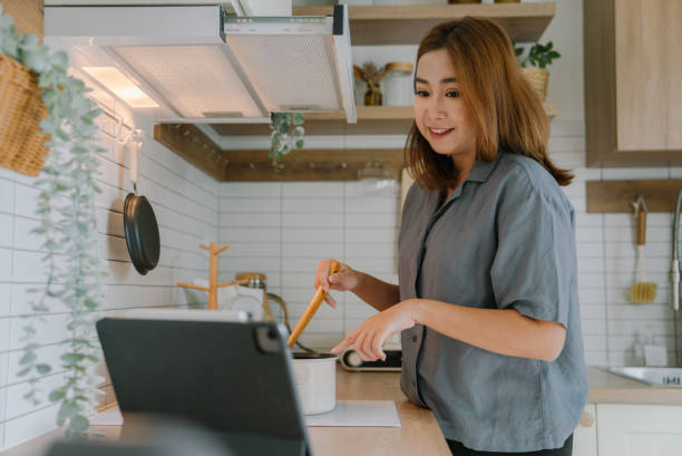 istock Asian freelancer working in kitchen room 1400112424