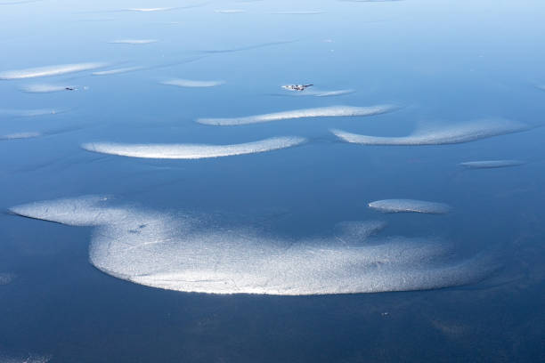 Ice and snow on frozen lake, Sweden.