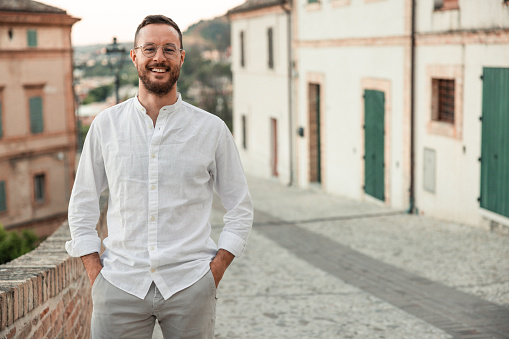 Portrait of an italian man posing while on vacation in a small town in Italy