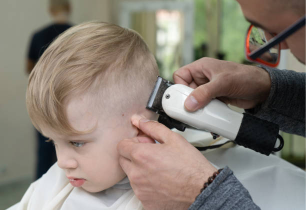istock little blond boy is having hair cut 1400114700