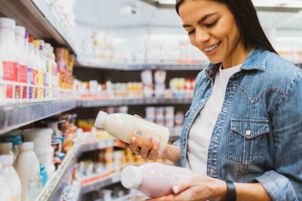 istock Happy young woman shopping 1400114900