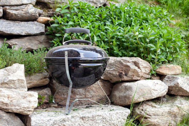 istock Barbecue grill in a garden standing on rocks 1400117086