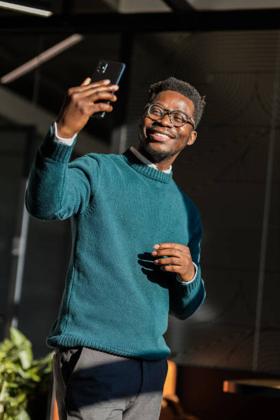 istock Smiling young black man taking a selfie 1400118883