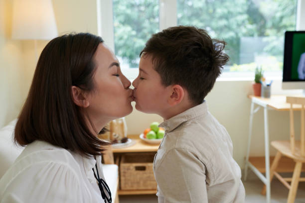 istock Mother Kissing Son 1400120313