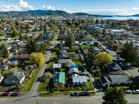 Bellingham, Washington USA aerial view above the city. Landscape of the lettered streets and Columbia neighborhoods looking into downtown, waterfront and WWU on a sunny day.