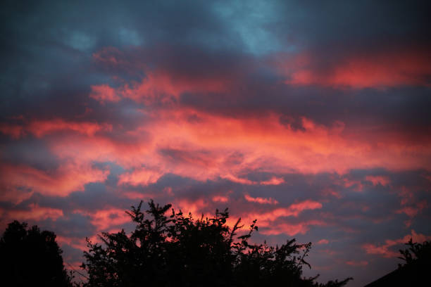A dark, red and moody sunset over Liverpool. The sky looks very dramatic over the small village of Lydiate. The photograph was taken on a warm May evening.