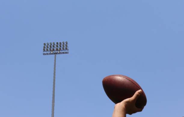 istock Throwing the football 1400121077
