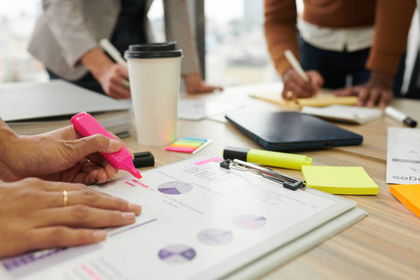 istock Businesswoman Highlighting Data in Report 1400121992