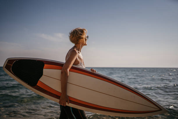 istock Surfer by the sea 1400122727