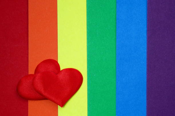 istock Rainbow homosexual color background with red hearts 1400123257