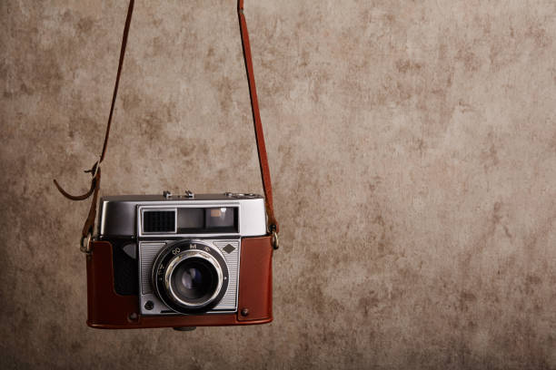 istock Analog vintage 35mm  film camera hanging on its strap 1400124492