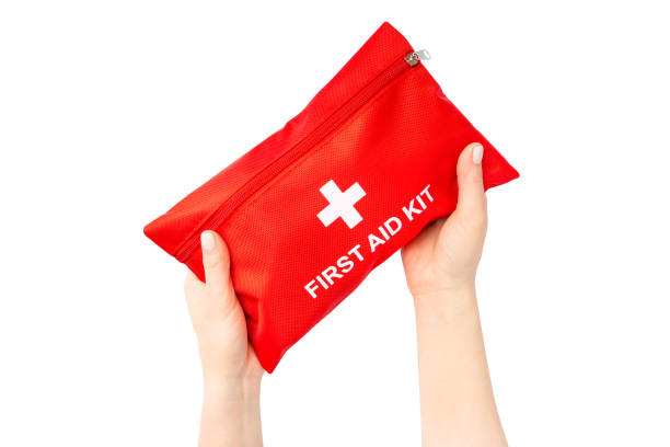 istock First Aid Kit in female hands isolated on white. Ready for clipping path. 1400125239