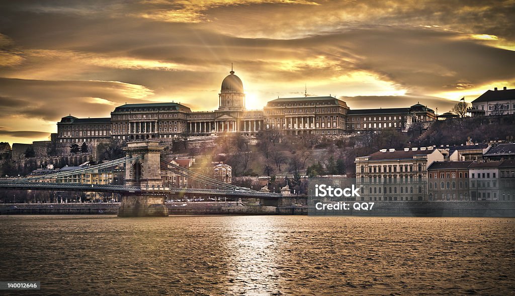 Szechenyi Chain Bridge and Royal Palace, HDR Hungarian landmarks, Chain Bridge, Royal Palace and Danube river in Budapest at sunset. HDR image. Architecture Stock Photo