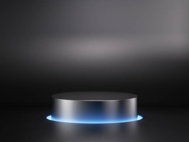 istock 3d render, abstract geometric background with empty metal cylinder podium illuminated with blue neon light. Minimalist showcase scene with round stage for product presentation 1400127305