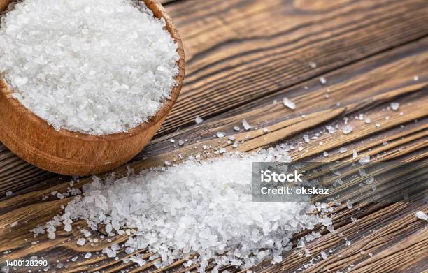 Salt In A Hodgepodge On A Wooden Table Stock Photo - Download Image Now - Baked Pastry Item, Bakery, Baking