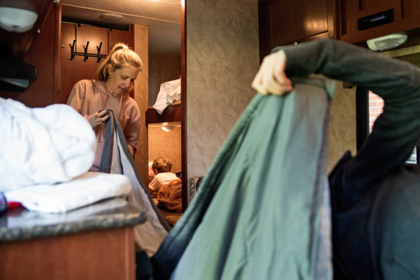 istock Mother and daughter getting RV ready for summer vacations. 1400128991
