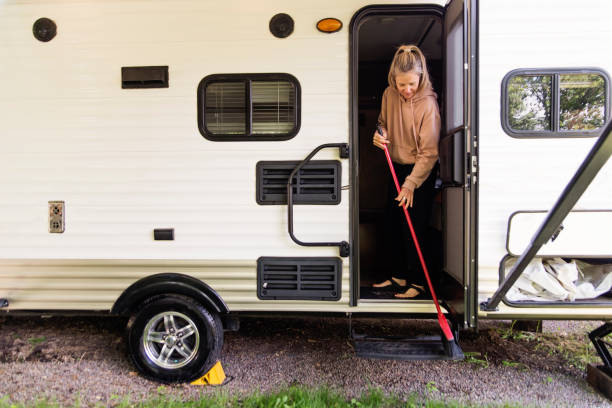 Mature woman getting RV ready for summer vacations. stock photo