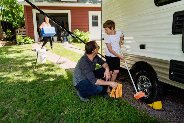istock Father and son getting RV ready for summer vacations. 1400129721