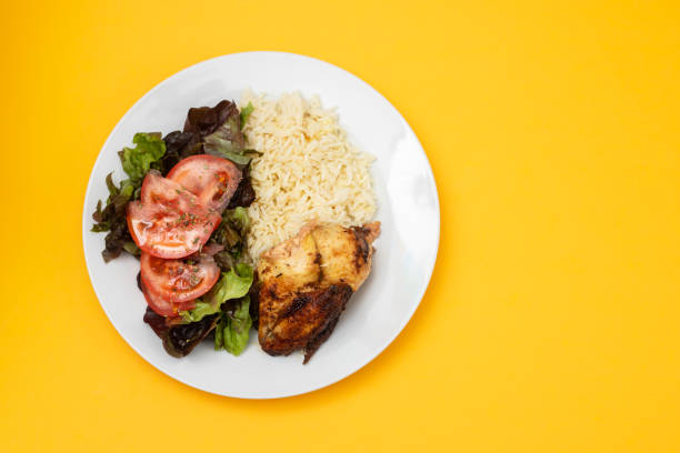 istock grilled chicken with boiled rice and fresh salad 1400132935