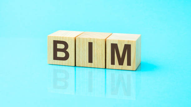 istock BIM - acronym from wooden blocks with letters, abbreviation BIM Building Information Modeling concept, blue background 1400134031