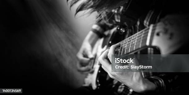 Electric Guitar Playing Young Men Playing Electric Guitar Stock Photo - Download Image Now