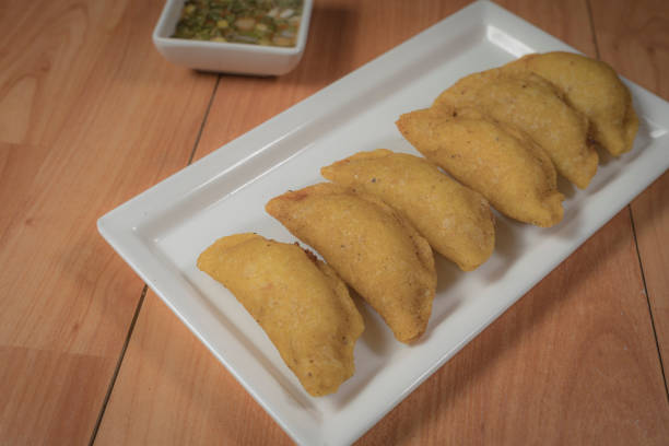 istock Colombian empanada with spicy sauce 1400134689