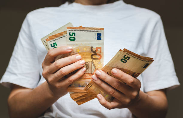 istock 50 euro banknotes in hands. 1400135290