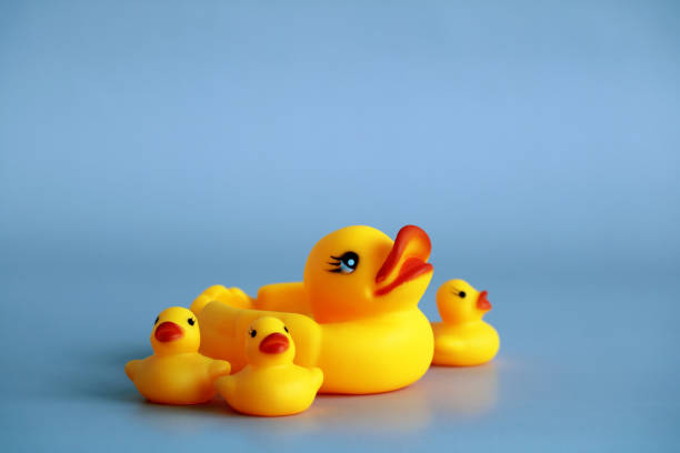 istock rubber duck with ducklings on a blue. 1400135686