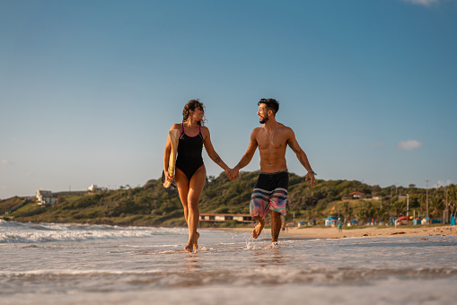 Young couple, Running, Hand in hand, Beach, Surf