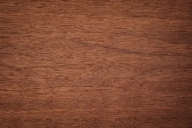 Photo of wood plank panel texture. outdated mahogany table background