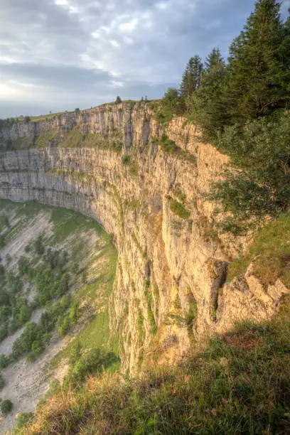 Famous cliff Creux du Van at Neuchatel by sunset, Switzerland