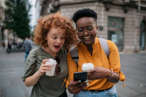 istock Two happy female tourists exploring a foreign city together 1400136564