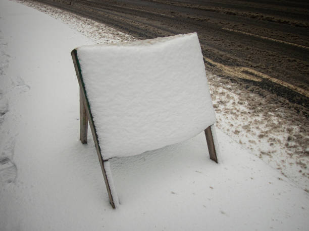istock Road sign covered in snow 1400137411