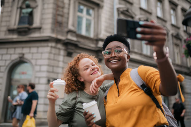 istock Two happy female friends taking a selfie 1400138961