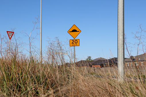 urban landscape with road signs and long grass