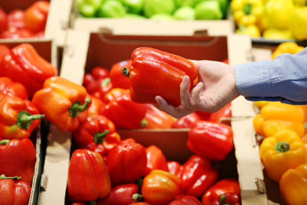 istock buying tomatoes at the market 1400140695