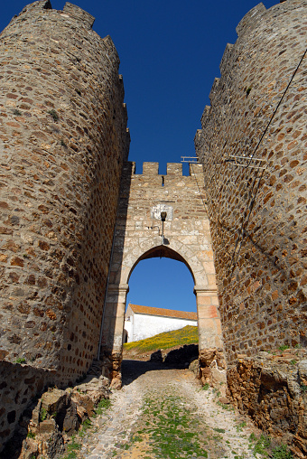 Évoramonte, Evora district, Alentejo, Portugal: Freixo gate with twin towers on the medieval walls, start of the ancient road to Freixo village.